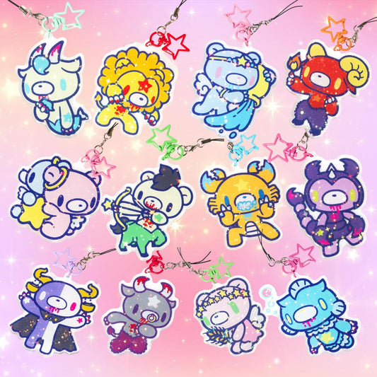 Colorful zodiac character charms on a pink background with stars